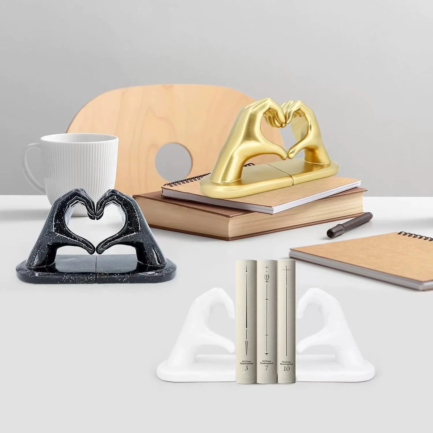 Golden Love Gesture Bookend — elegant resin décor for home or office.